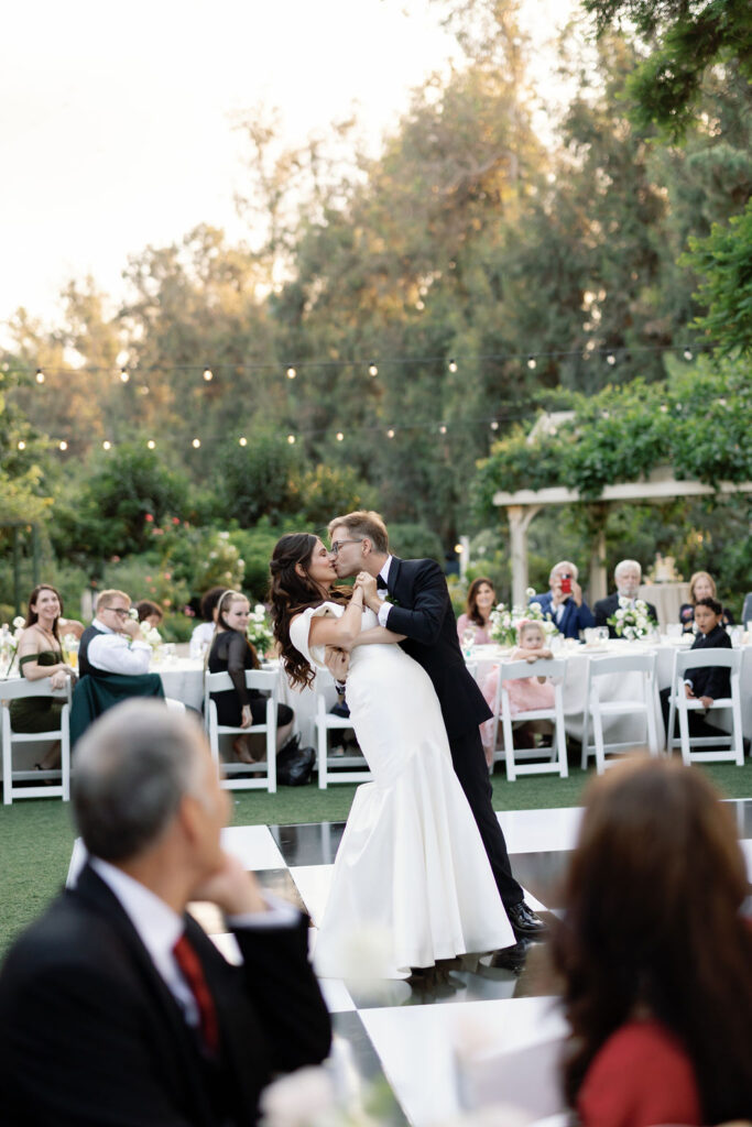First dance on the black-and-white checkered dance floor during the McCormick Home Ranch wedding reception.