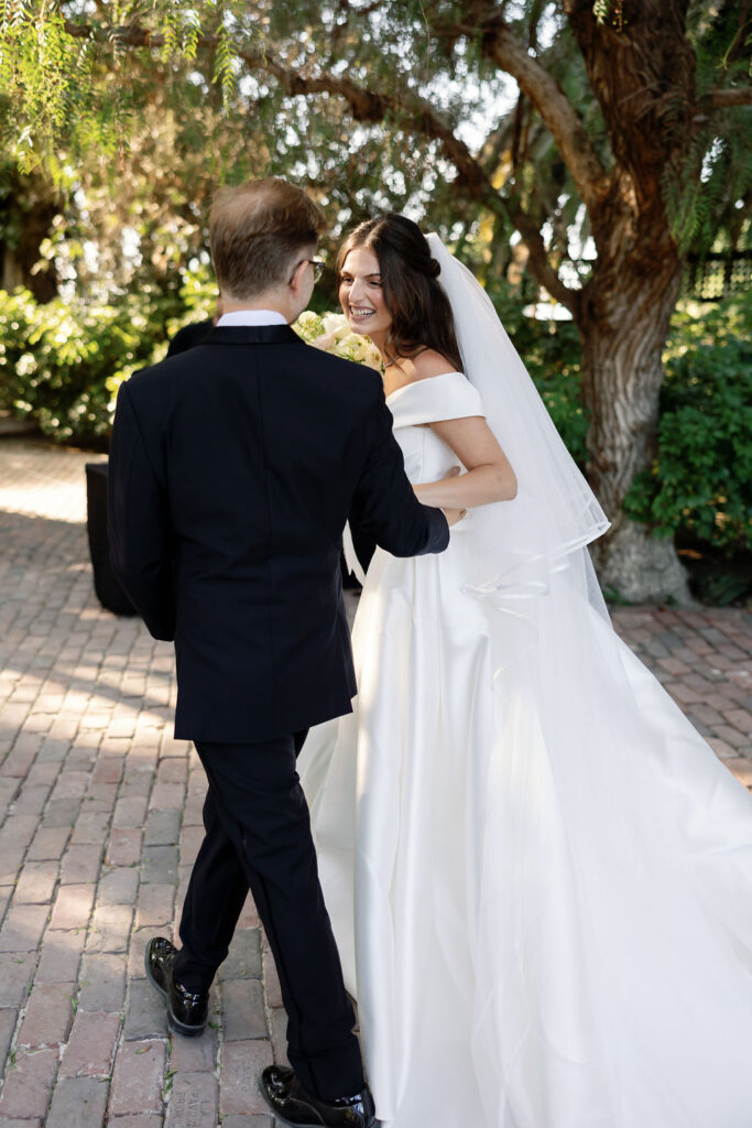 Bride and groom sharing a happy moment together immediately after being announced as married.