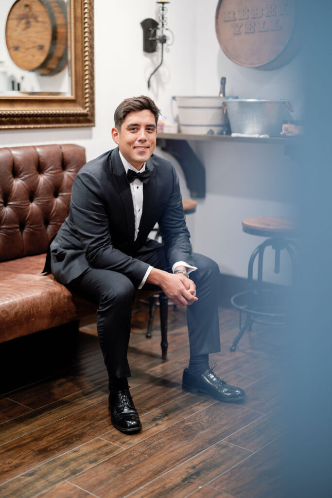 Indoor grooms portrait in the Grooms Lounge at La Ventura Event Center in San Clemente, CA