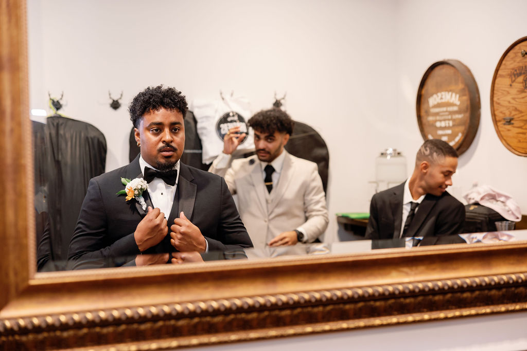 Groom and his groomsmen getting ready in the Grooms Lounge at La Ventura Event Center in San Clemente, CA