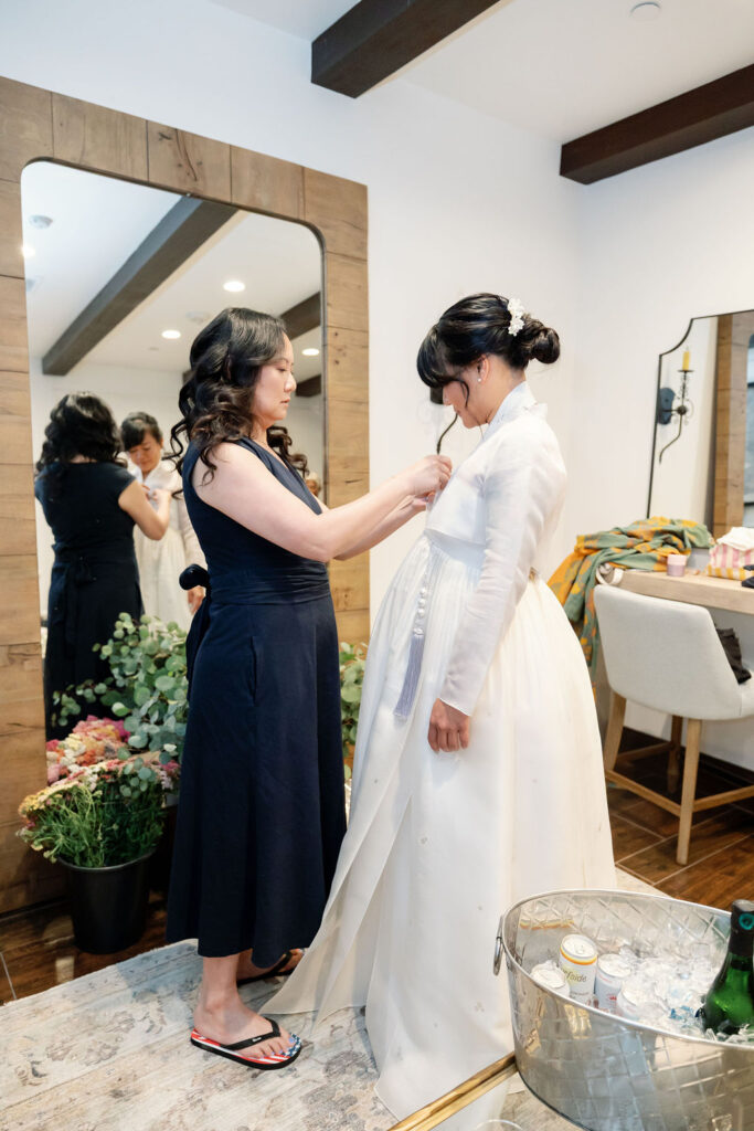 Bride getting ready in the Bridal Suite at La Ventura Event Center in San Clemente, CA