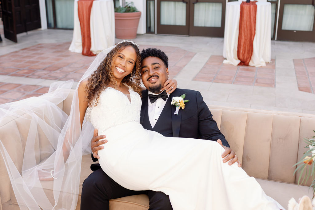 Bride and groom posing for portraits at La Ventura San Clemente.