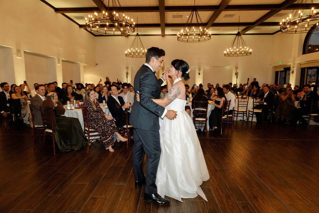 Bride and groom dancing during their indoor wedding reception in the Grand Parlour at La Ventura San Clemente.