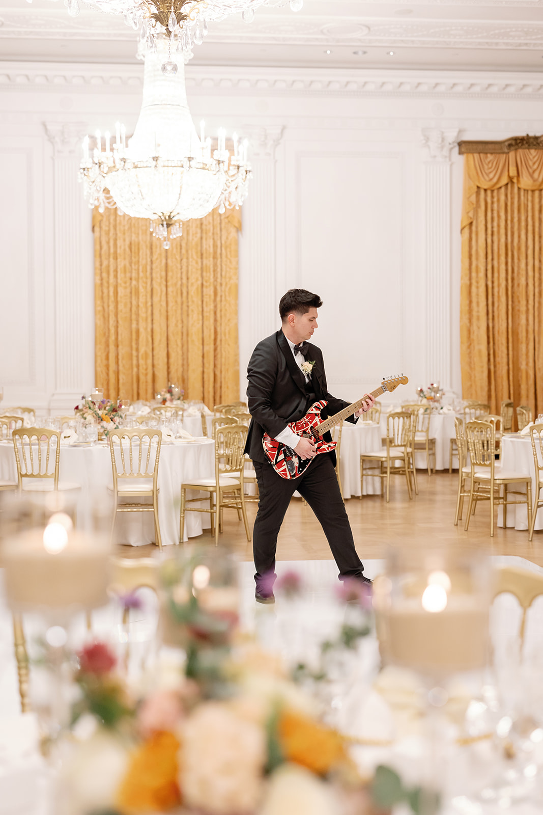 Groom playing guitar.
