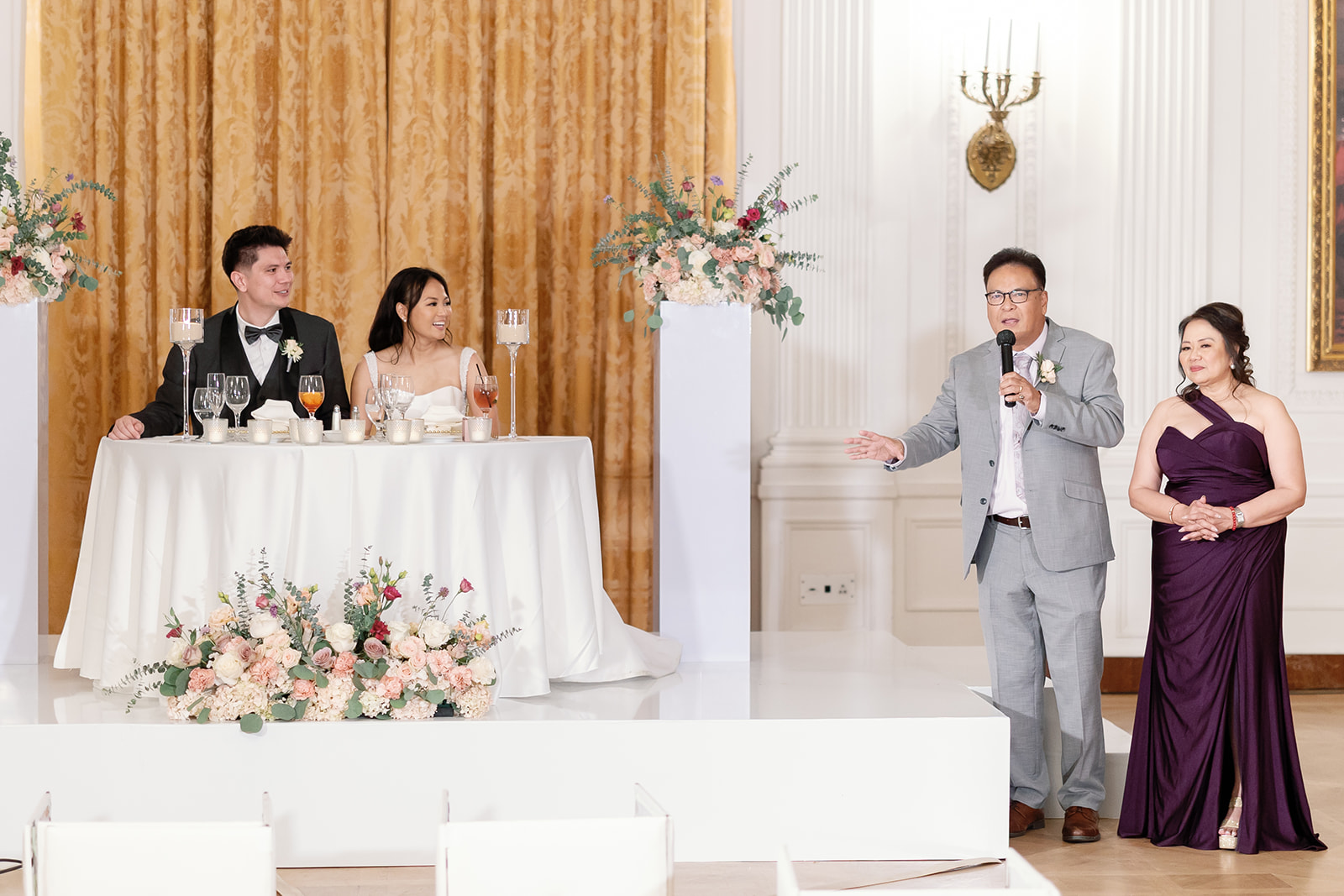 Parents give a heartfelt toast during the Nixon Library Yorba Linda wedding reception in the White House East Room.