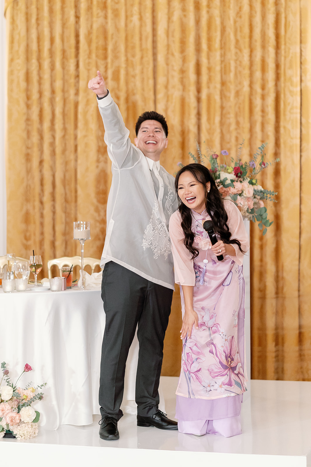 Bride and groom giving speeches during their reception.
