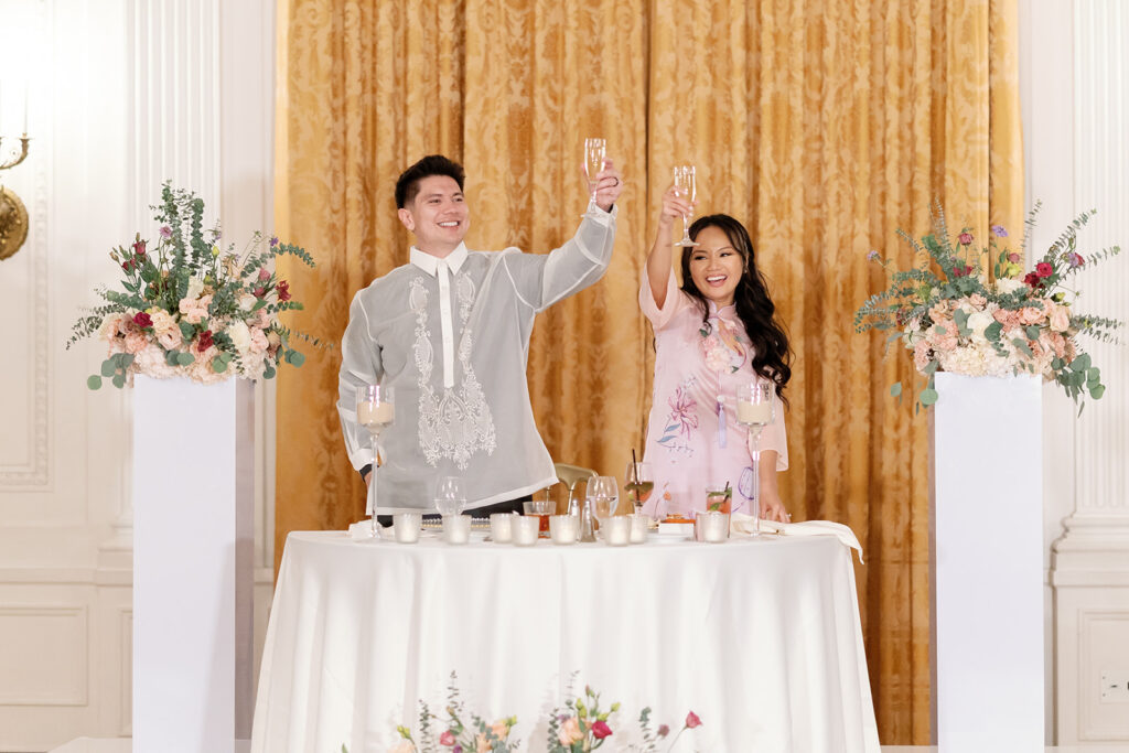 Newlyweds raise a champagne toast at their White House East Room reception at the Nixon Library Yorba Linda.