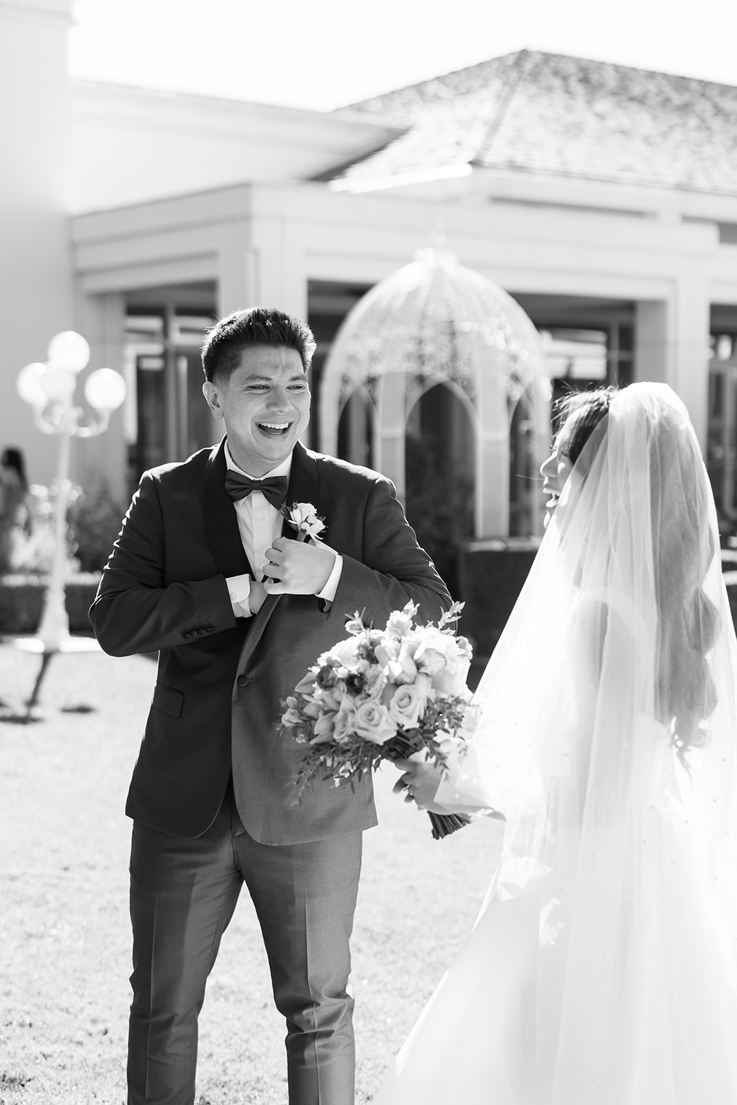 Groom getting emotional after seeing his bride during their first look in the Rose Garden at Nixon Library.