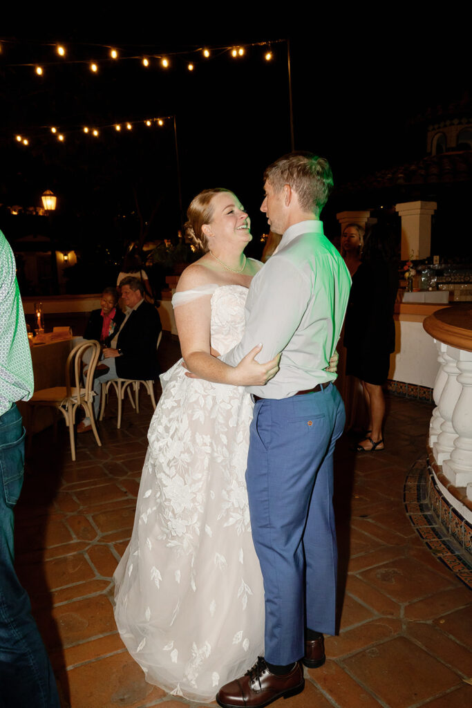 Bride and groom dancing during the end of the their reception.