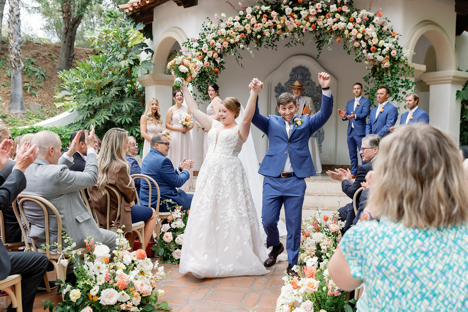 Bride and groom celebrating their ceremony recessional at El Teatro at Rancho Las Lomas.