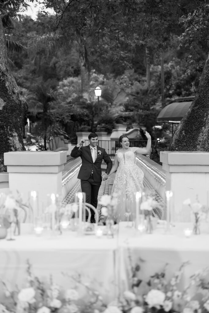 Bride and groom walking into their El Teatro reception space at Rancho Las Lomas.