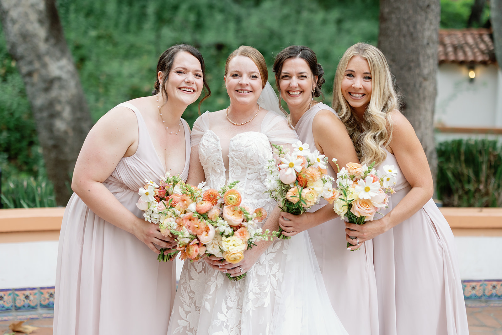Outdoor bride and bridesmaids portraits from a Ranch Las Lomas wedding in California.