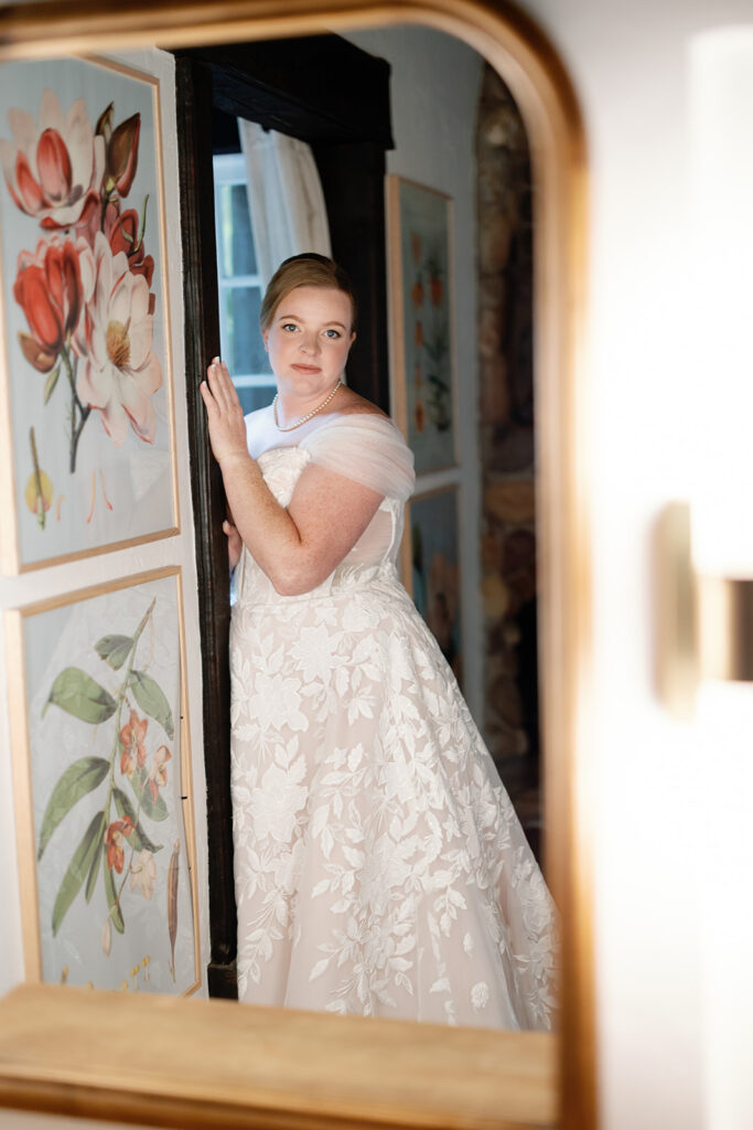 Bride posing in her lace wedding gown inside Casa Abuela before her Rancho Las Lomas wedding.