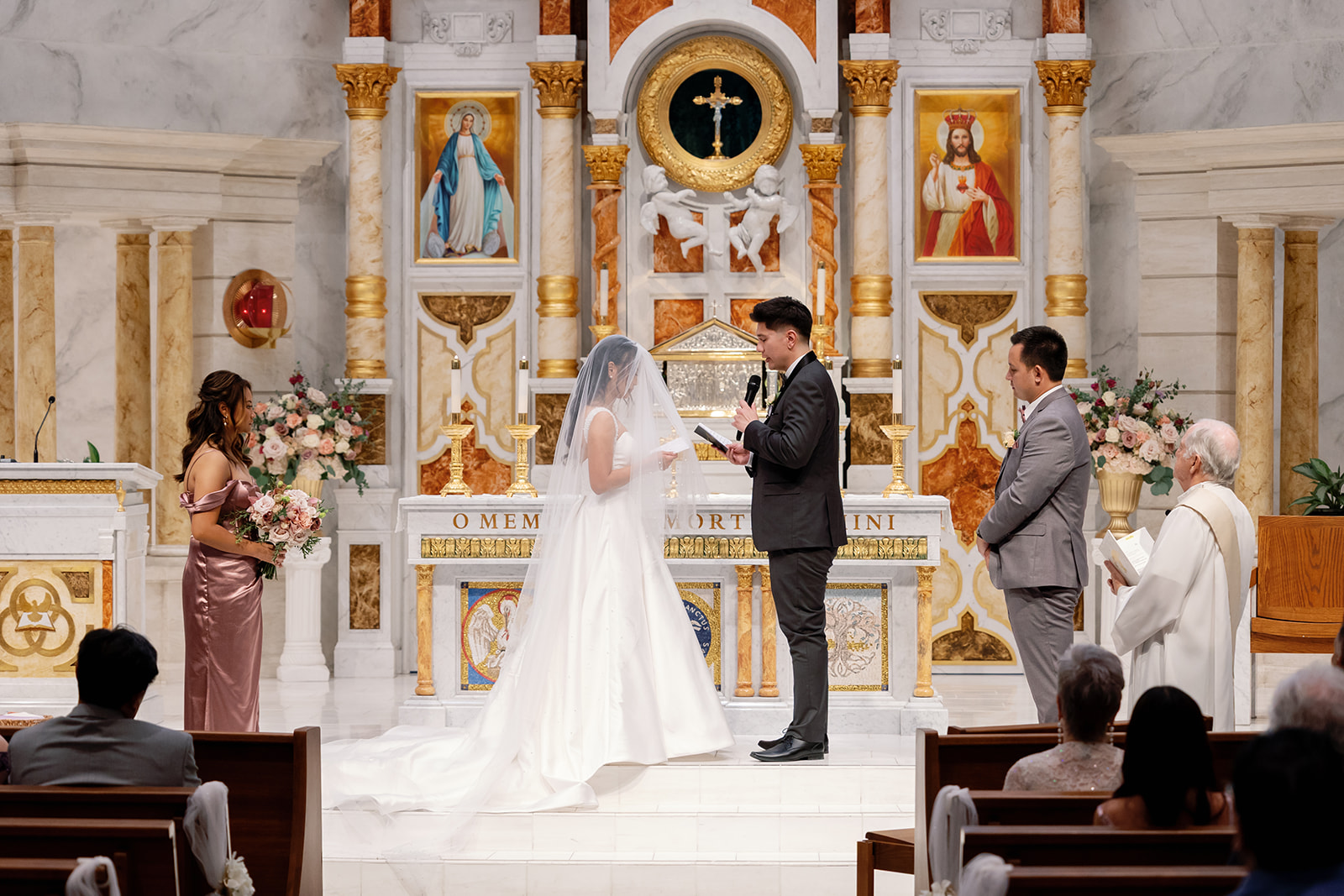Bride and groom exchanging vows during their St. Martin de Porres Church wedding ceremony in Yorba Linda.