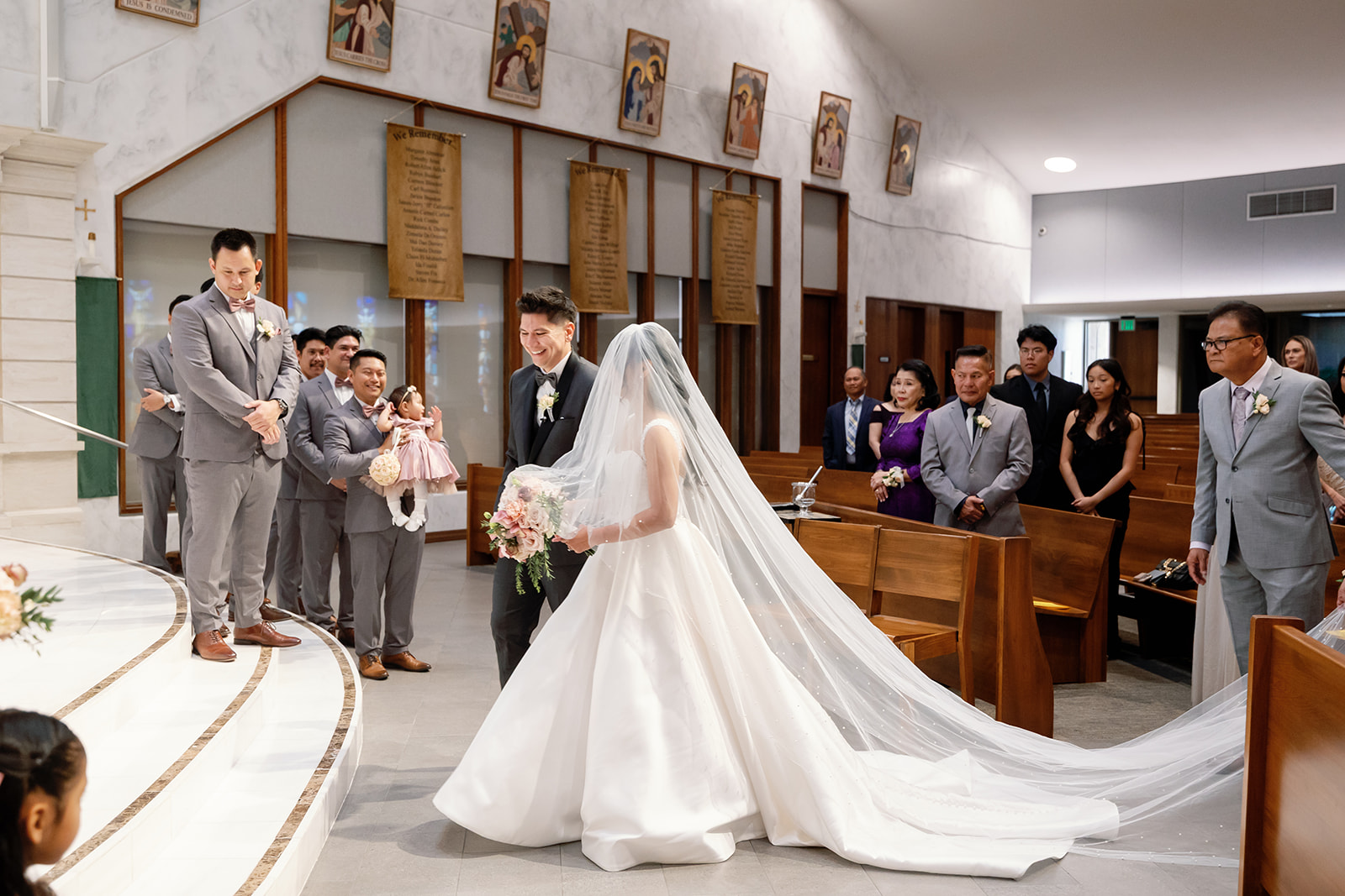 Bride and groom standing at the altar at St. Martin de Porres Church in Yorba Linda.