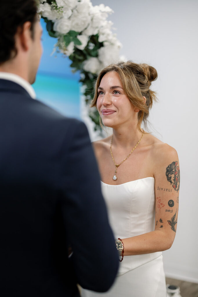 Close up shot of a bride and groom holding hands during their Laguna Holl Courthouse elopement.