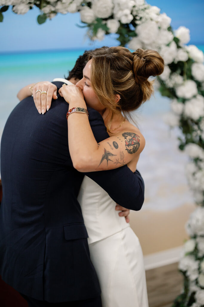 Bride hugging groom emotionally during Laguna Hills Courthouse elopement ceremony.
