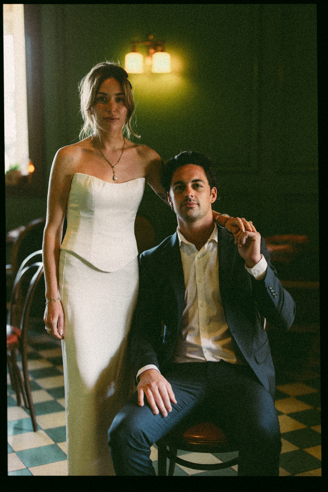 35mm film portrait of a bride and groom posing at Habana Irvine Spectrum after Laguna Hills Courthouse elopement.
