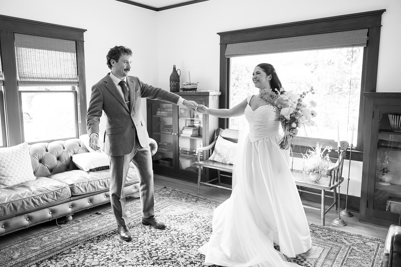 Bride and groom first look moment inside Swanner House wedding venue.