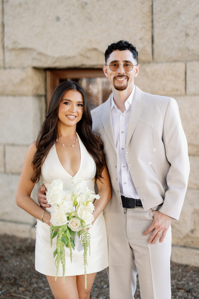 Close up portrait of a bride and groom kissing.