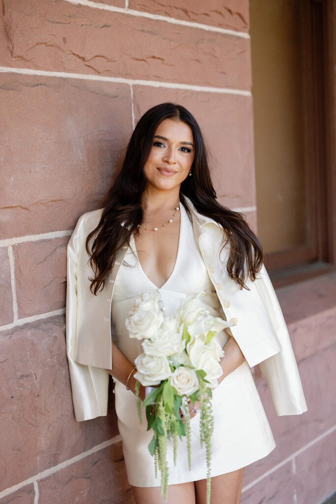 Bride posing outside of Orange County Courthouse in Santa Ana, California.