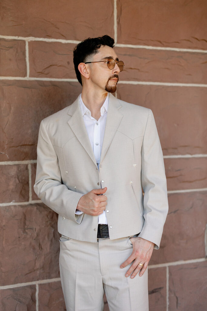 Groom portrait outside Old Orange County Courthouse wedding in Santa Ana.