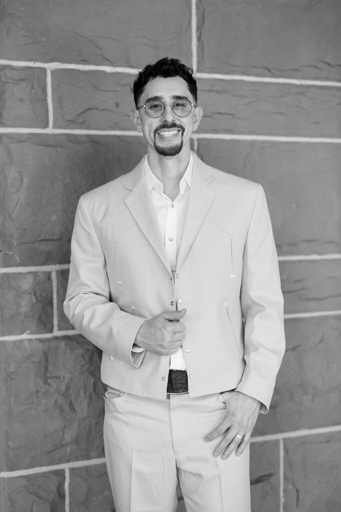 Groom portrait in black and white outside Old Orange County Courthouse wedding in Santa Ana.