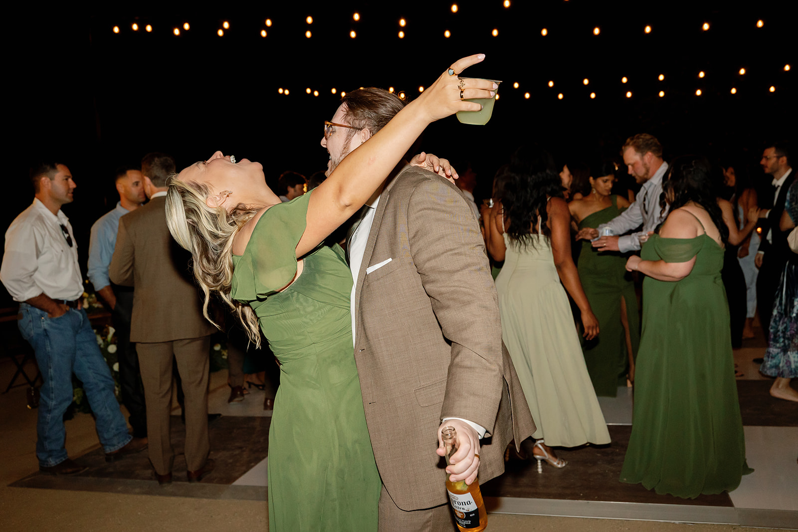 Guests dancing during a fun Swanner House wedding reception in San Juan Capistrano.