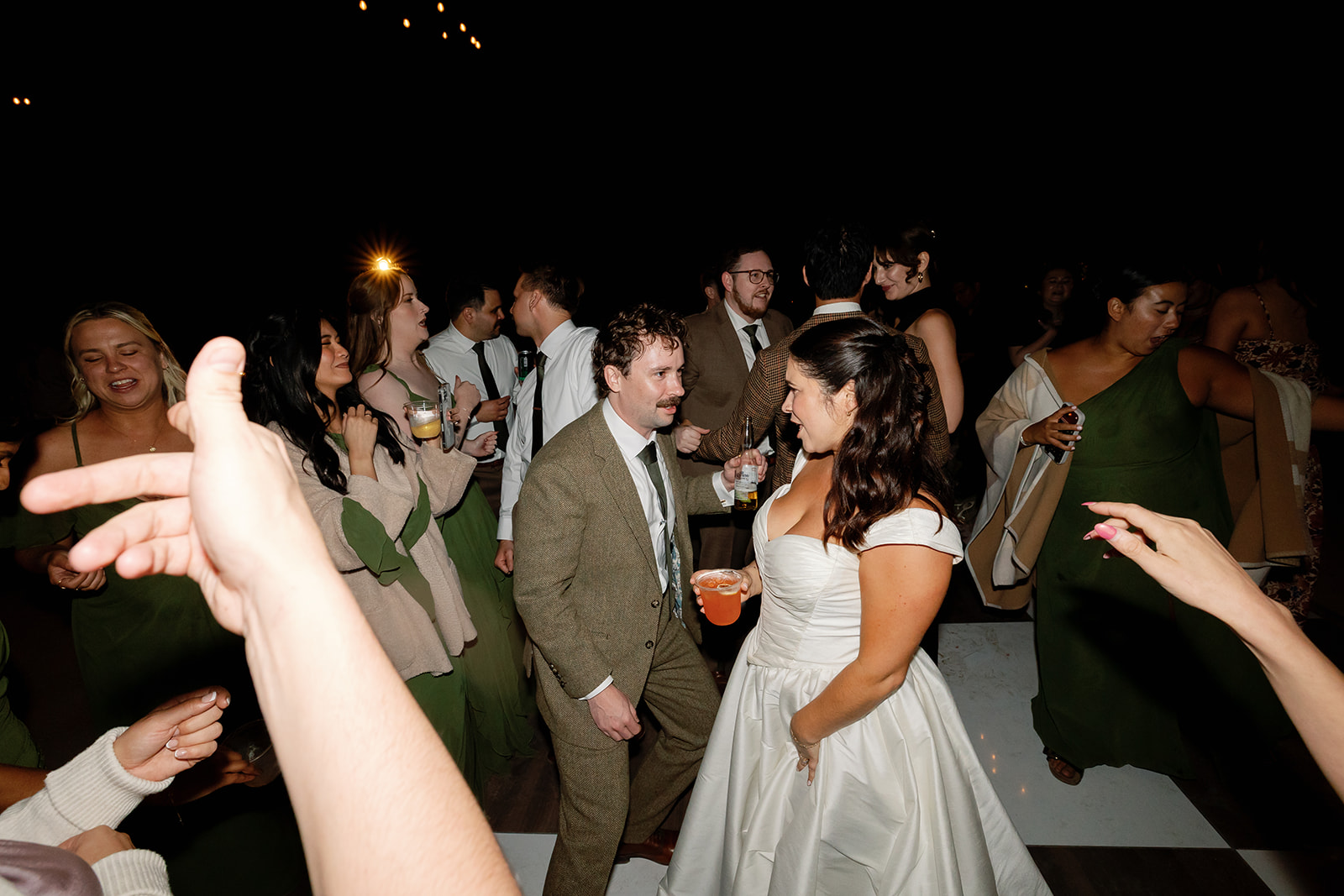 Bride and groom dancing together during reception at a Swanner House wedding in San Juan Capistrano.