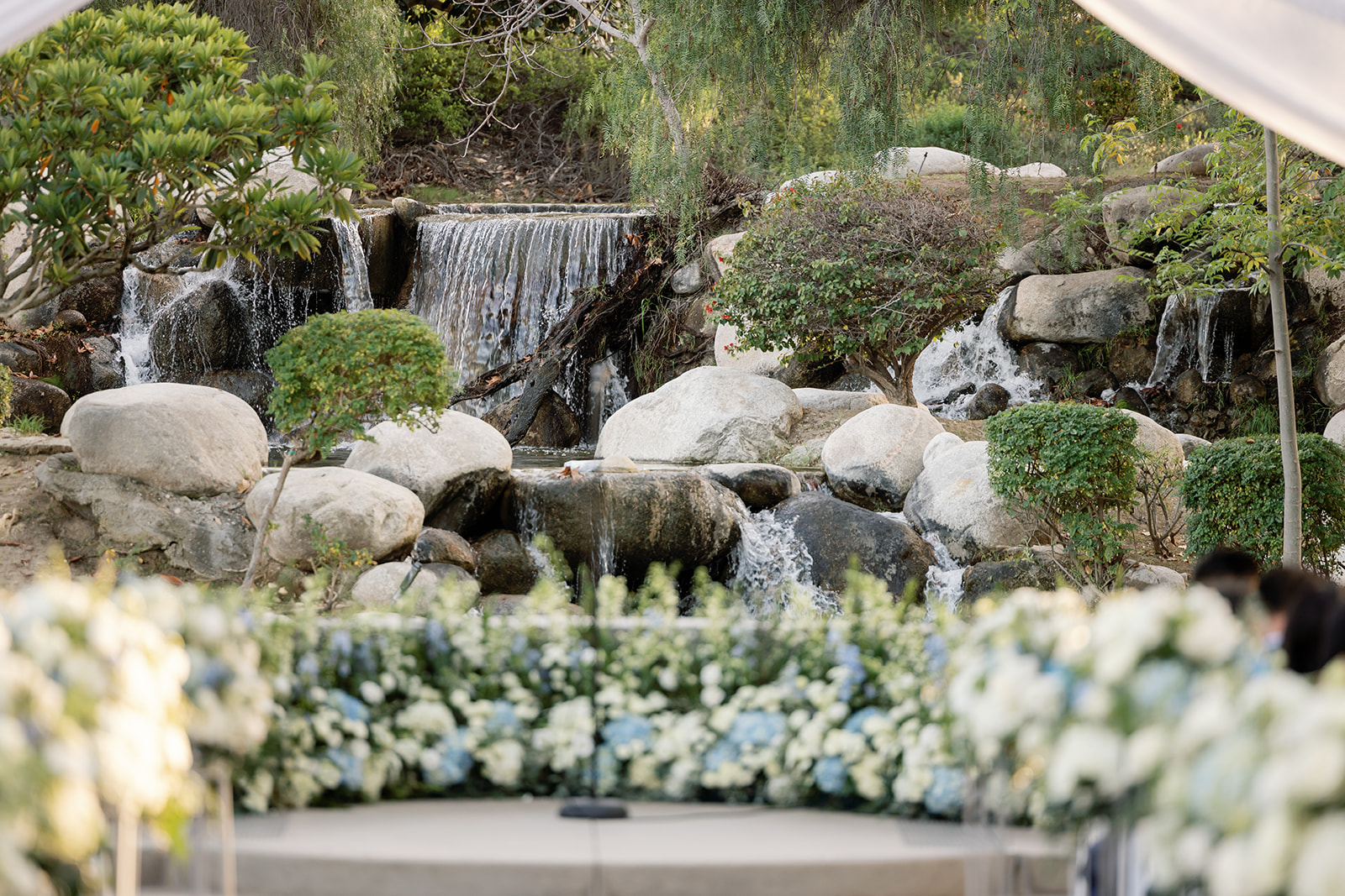 A romantic Coyote Hills Golf Course wedding ceremony setup at the waterfall.