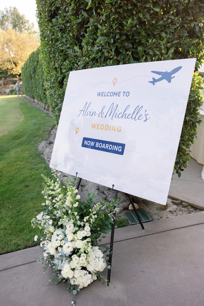 A travel inspired welcome wedding sign that says no boarding. 