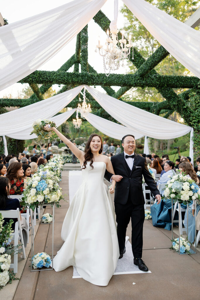 Bride and groom walking back down the aisle after their Coyote Hills Golf Course wedding.