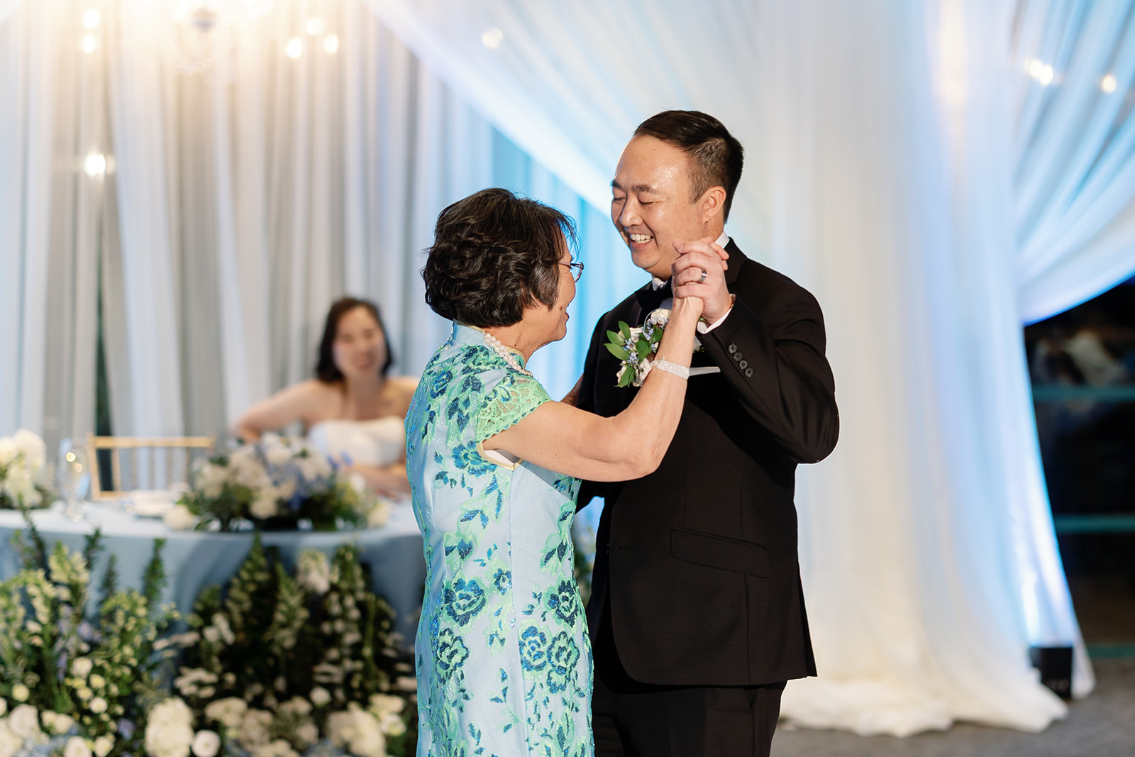 Groom dancing with his mother.