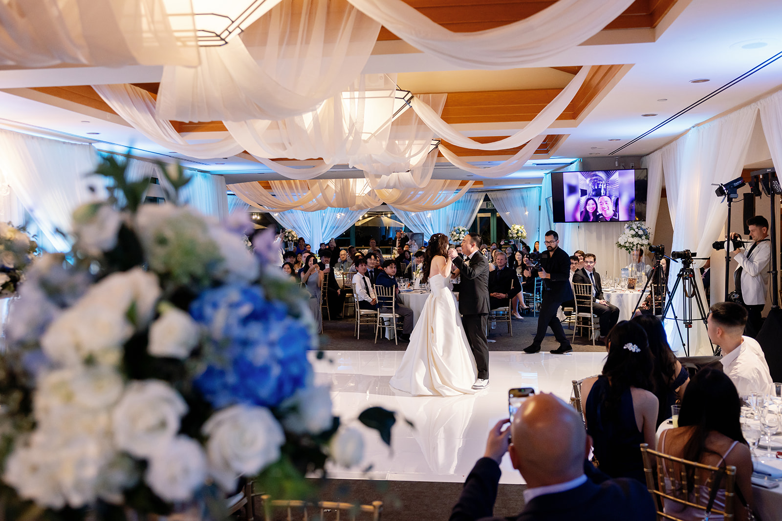 Bride and groom sharing their first dance for their Coyote Hills Golf Club wedding reception in the Vista Falls Pointe Ballroom.