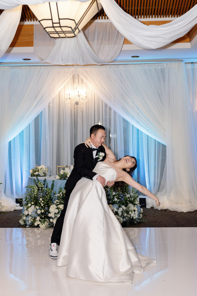 Bride and groom dipping at the end of their first dance.
