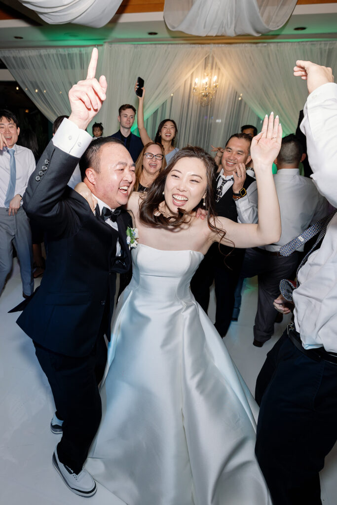 Bride and groom dancing during their Coyote Hills Golf Club wedding reception in the Vista Falls Pointe Ballroom.