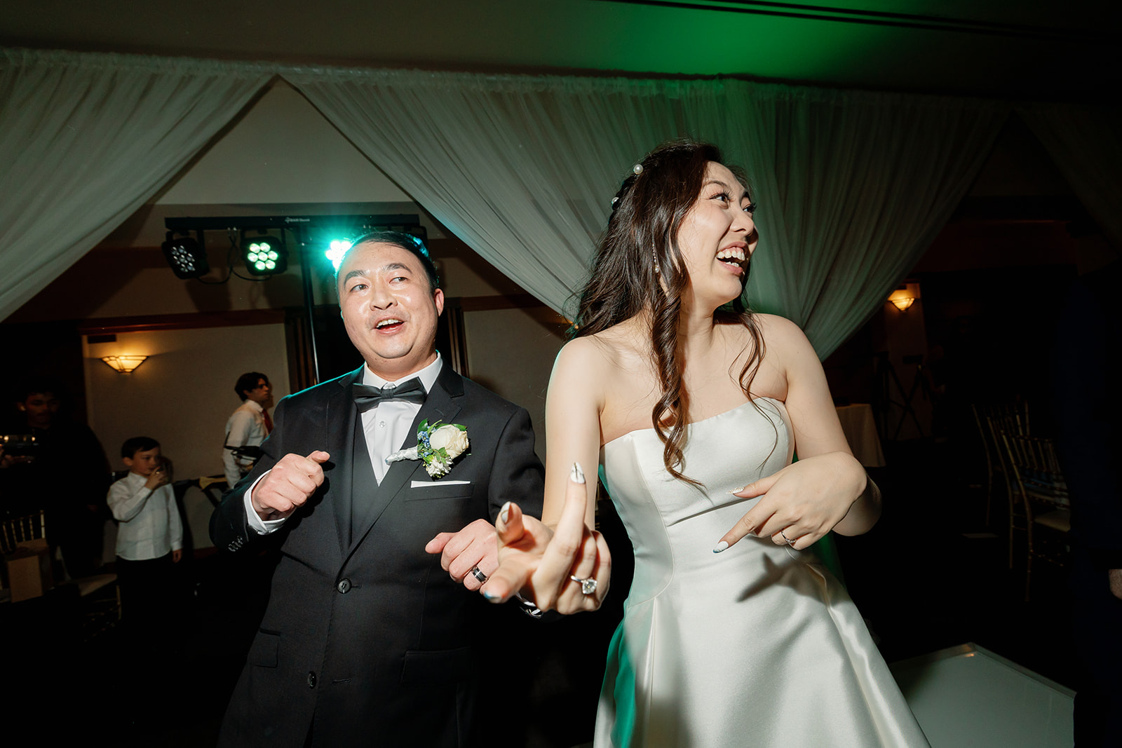 Bride and groom dancing together.