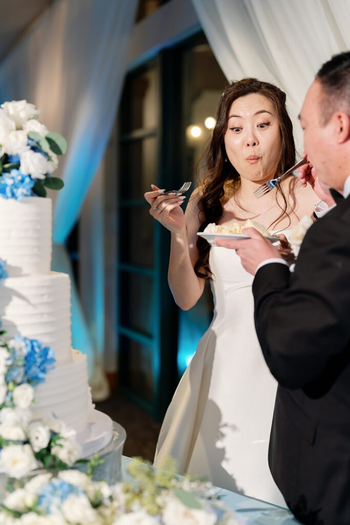 Bride and groom eating their wedding cake.