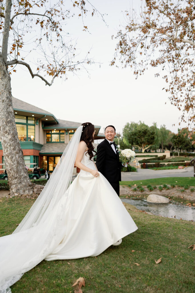 Bride and groom walking the property at Coyote Hills Golf Course in Fullerton, CA.