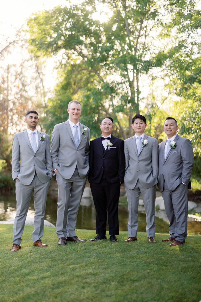 Outdoor groom and groomsmen portraits at Coyote Hills Golf Course.