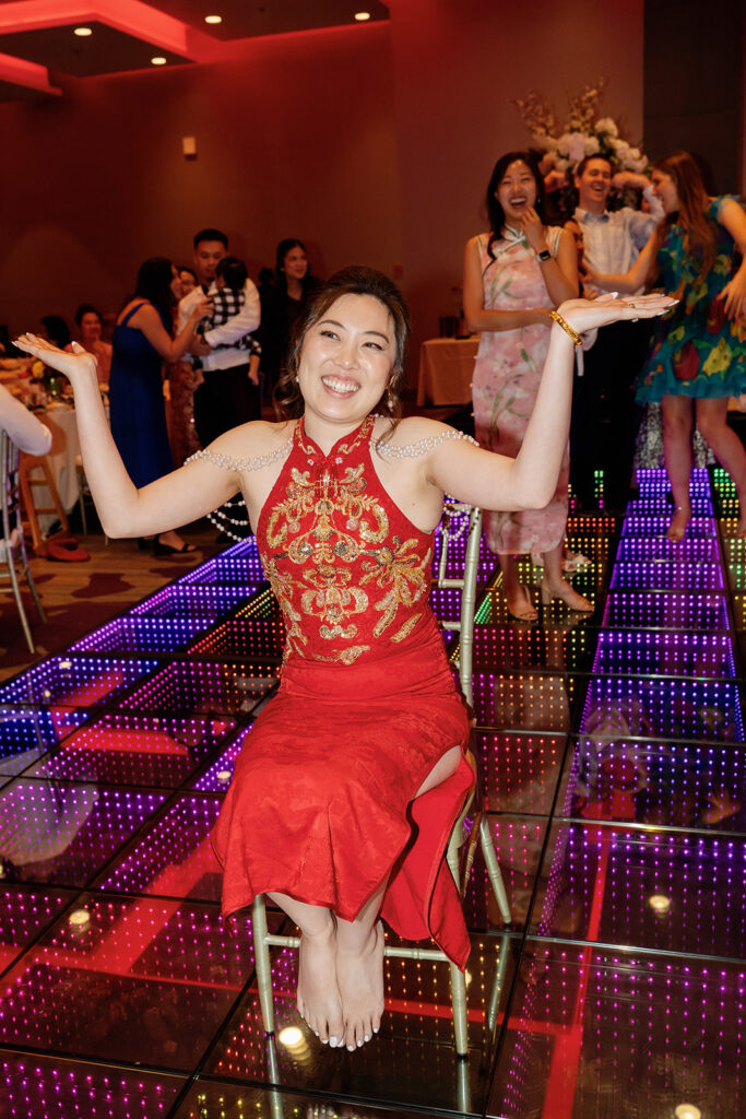 Bride laughing during a tea ceremony reception at Marriott Los Angeles Monterey Park.