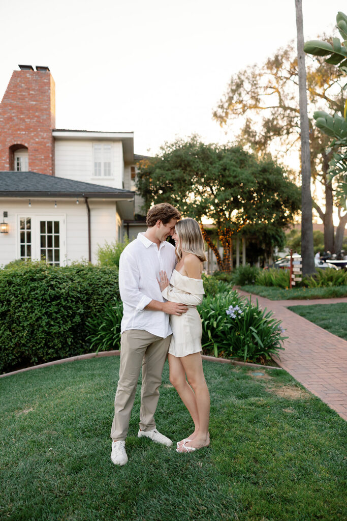 Couple posing on the lawn area at El Encanto in Santa Barbara.