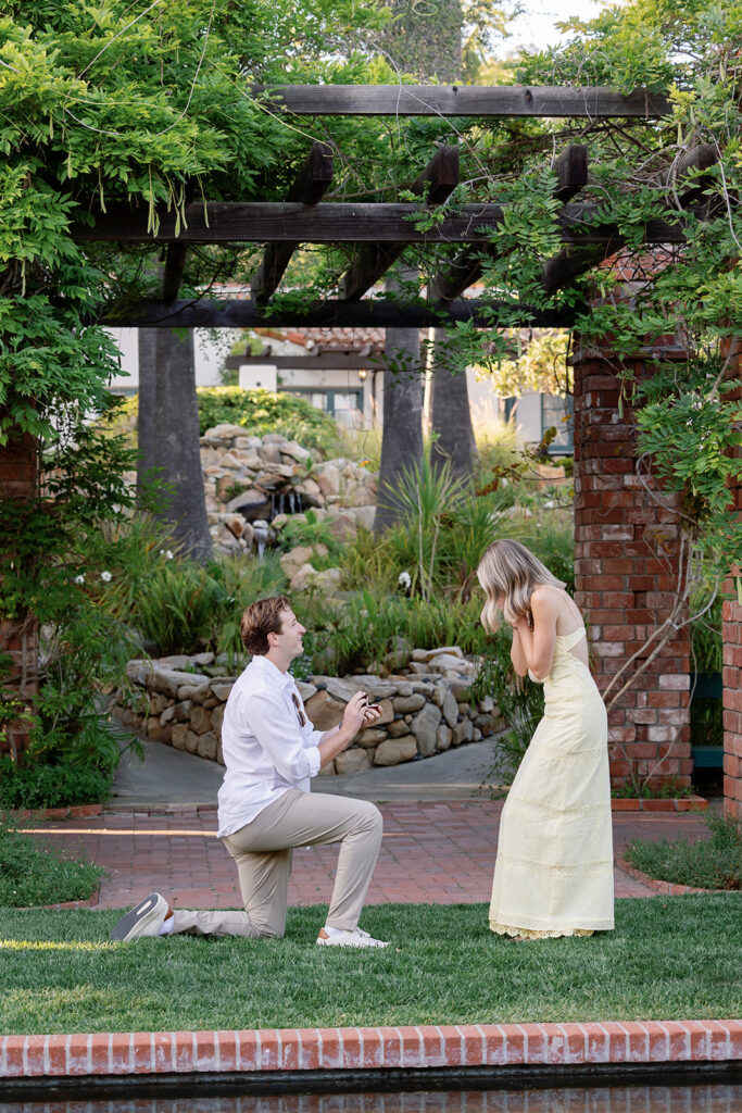 Man down on one knee proposing at El Encanto during a Santa Barbara proposal.