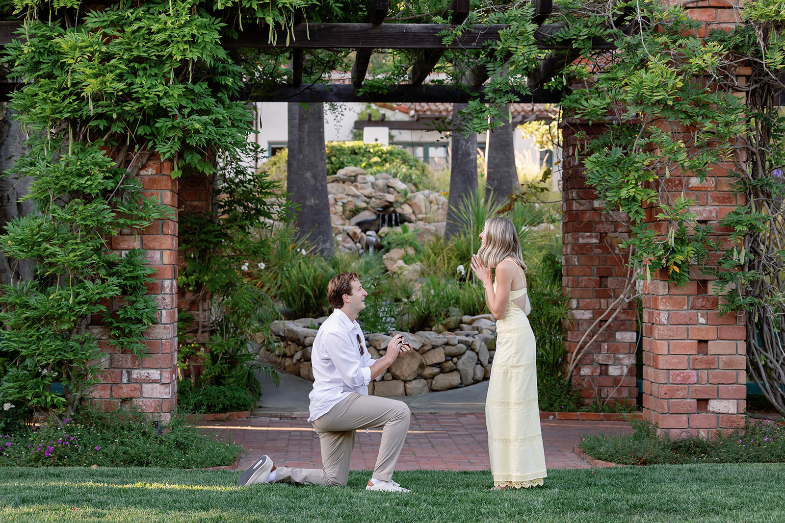 Man proposing during a Santa Barbara proposal at El Encanto near the Arbor and Lily Pond.