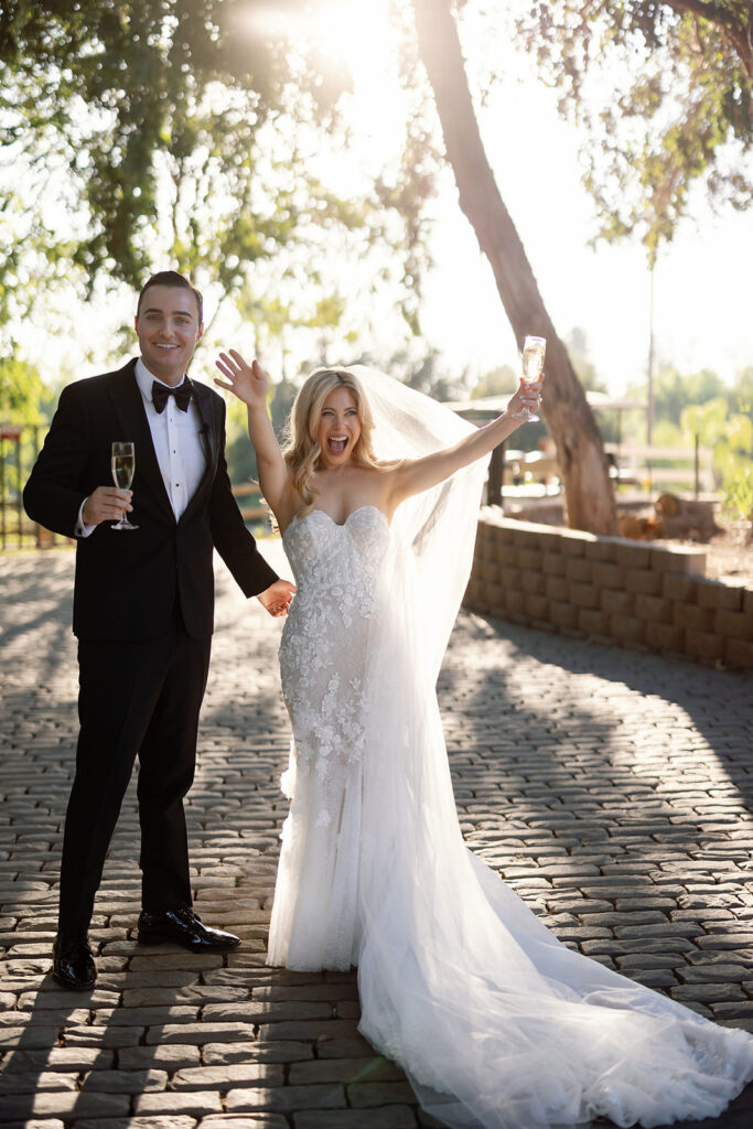 Bride and groom celebrating with excitement after their Lake Oak Meadows wedding ceremony.