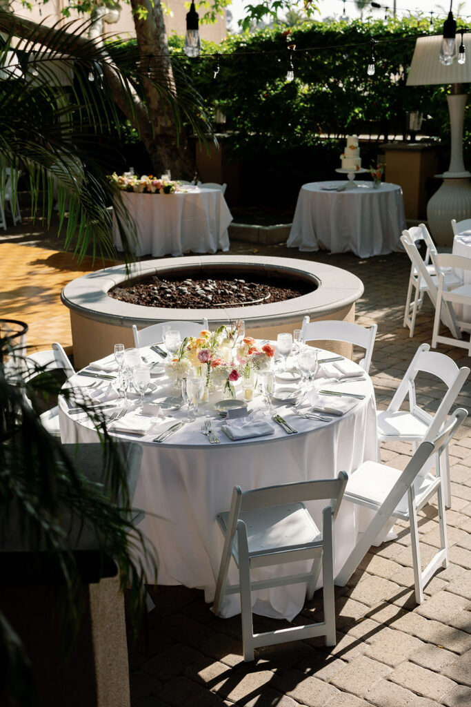 An outdoor wedding reception setup in the the Hyatt Regency Newport Beach Garden.