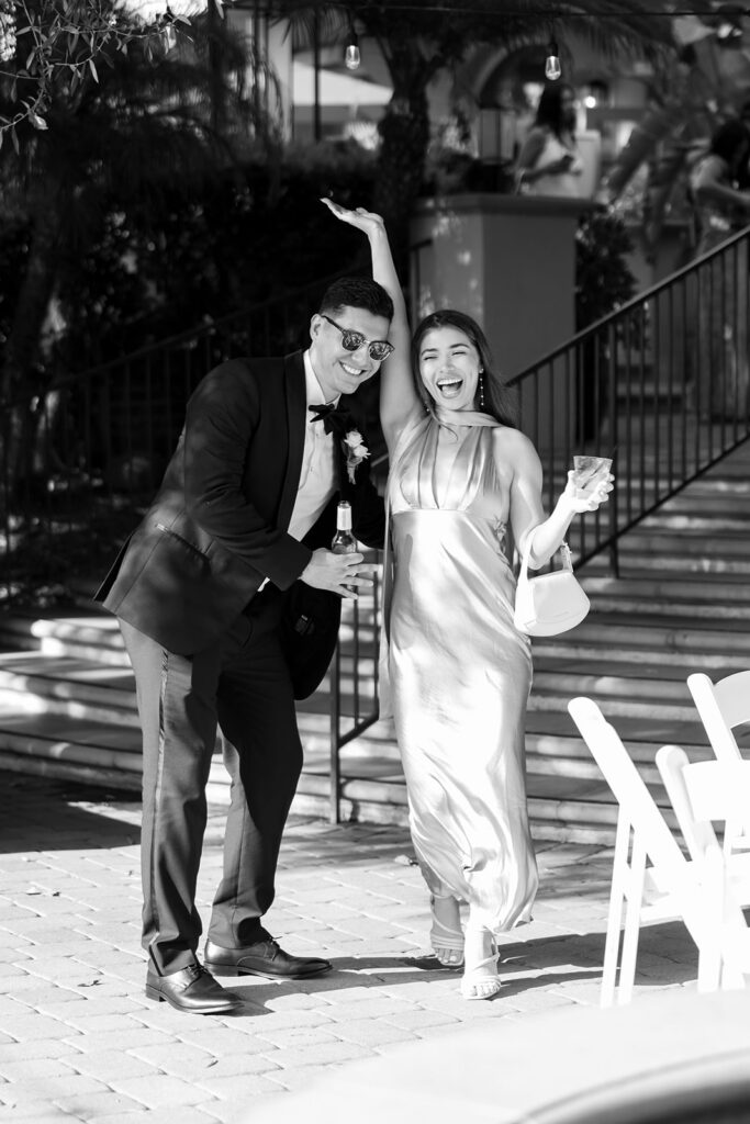 Wedding guests celebrating together with drinks during cocktail hour at Hyatt Regency Newport Beach.