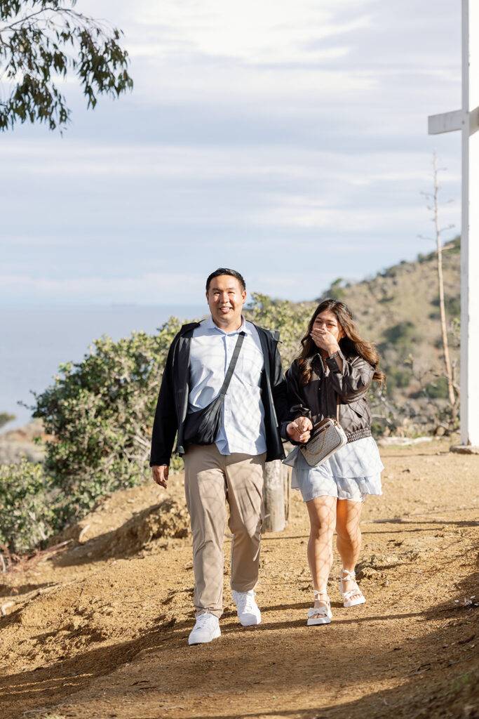 Couple walking to the proposal setup. 