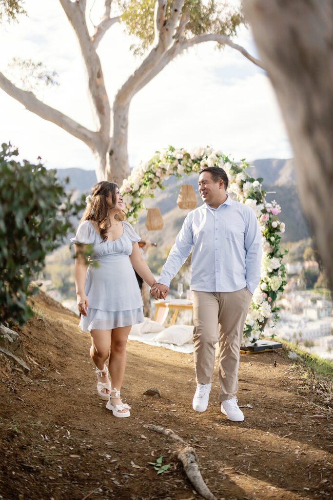 Couple walking hand in hand after their Catalina Island Proposal at Buena Vista Point.