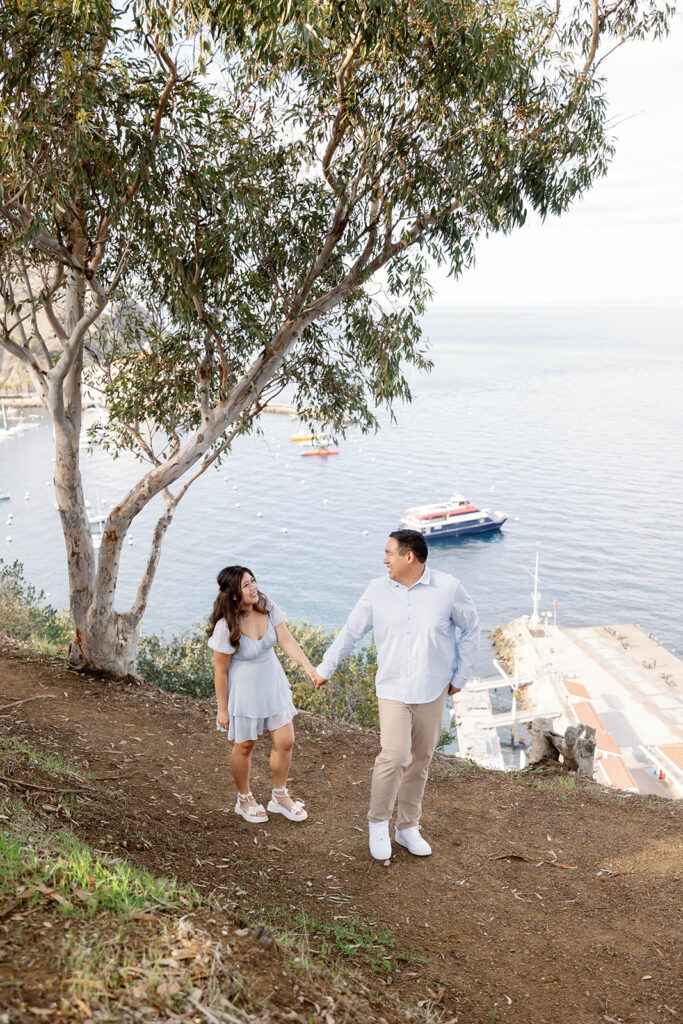 Couple walking near Buena Vista Point for their Catalina Island engagement photos.
